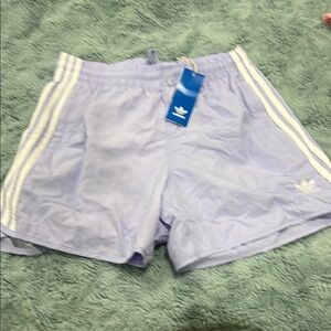 Adidas Purple Athletic Shorts with Iconic Stripes